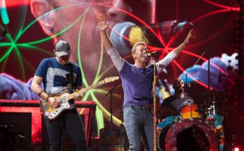 Chris Martin in concert with Coldplay.