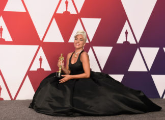 Lady Gaga with her Oscar award for best original song