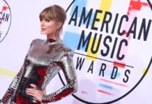 Taylor Swift Makes History as the First Artist to Land Top 10 Tracks on Billboard Hot 100 Taylor Swift at the American Music Awards in 2018